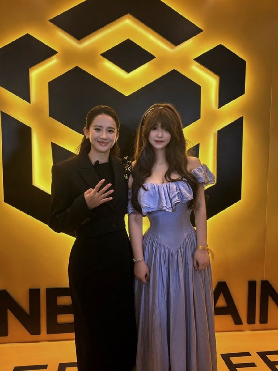 A Binance co-founder throwing the 4 sign